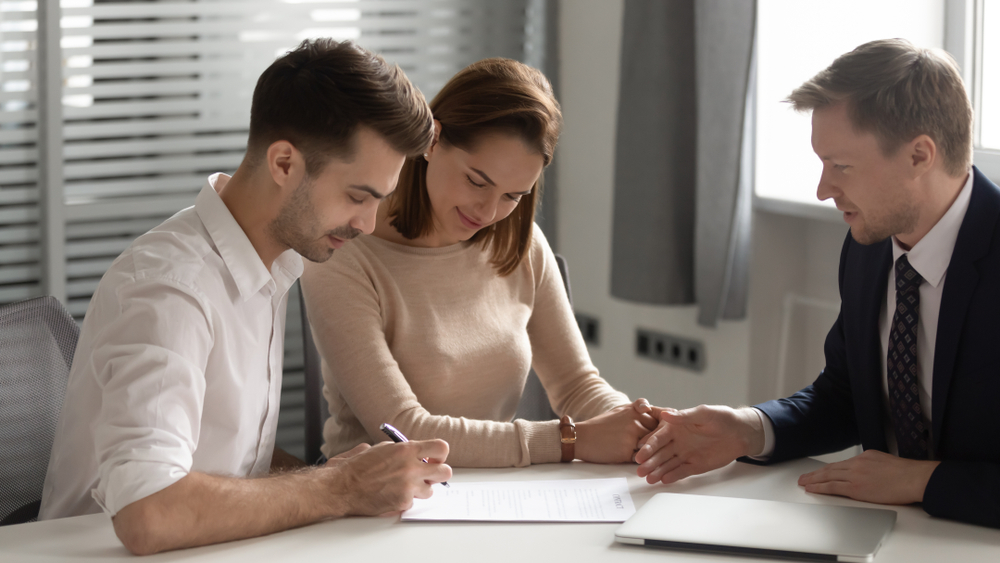 couple consulting a lawyer for their prenuptial agreement